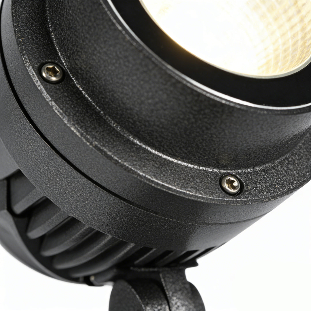 LED landscape spotlight angled head detail with cooling fins and screws visible.