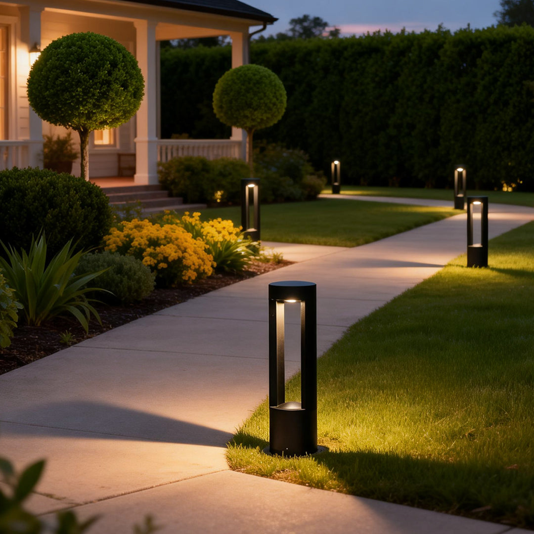 LED light bollard enhancing a contemporary driveway with elegant ambient light.