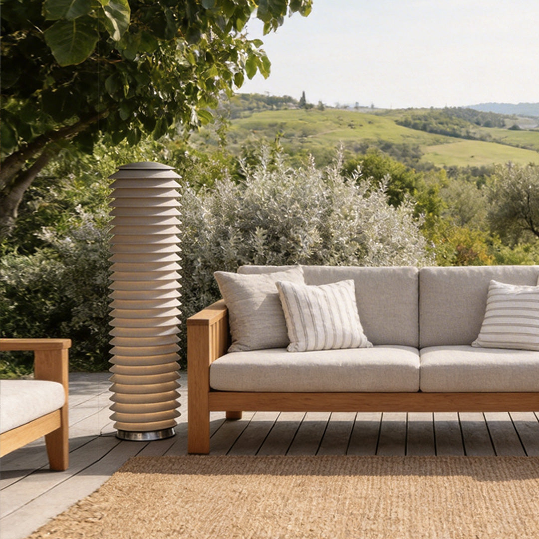 LED light bollard with a contemporary design, enhancing a garden patio.