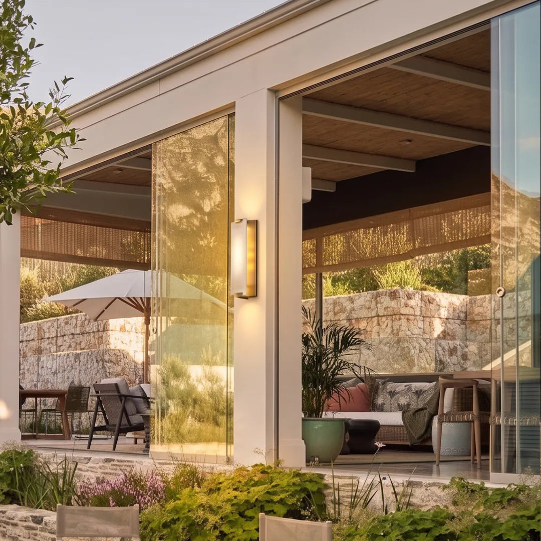 LED light wall lamp mounted beside a glass patio entrance for modern outdoor accent lighting.