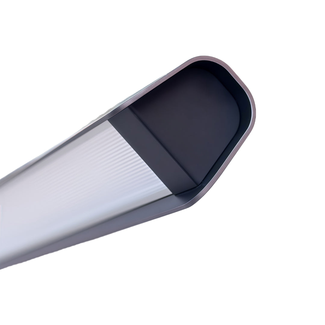 Close-up detail of LED linear suspension light with curved diffuser housing design.