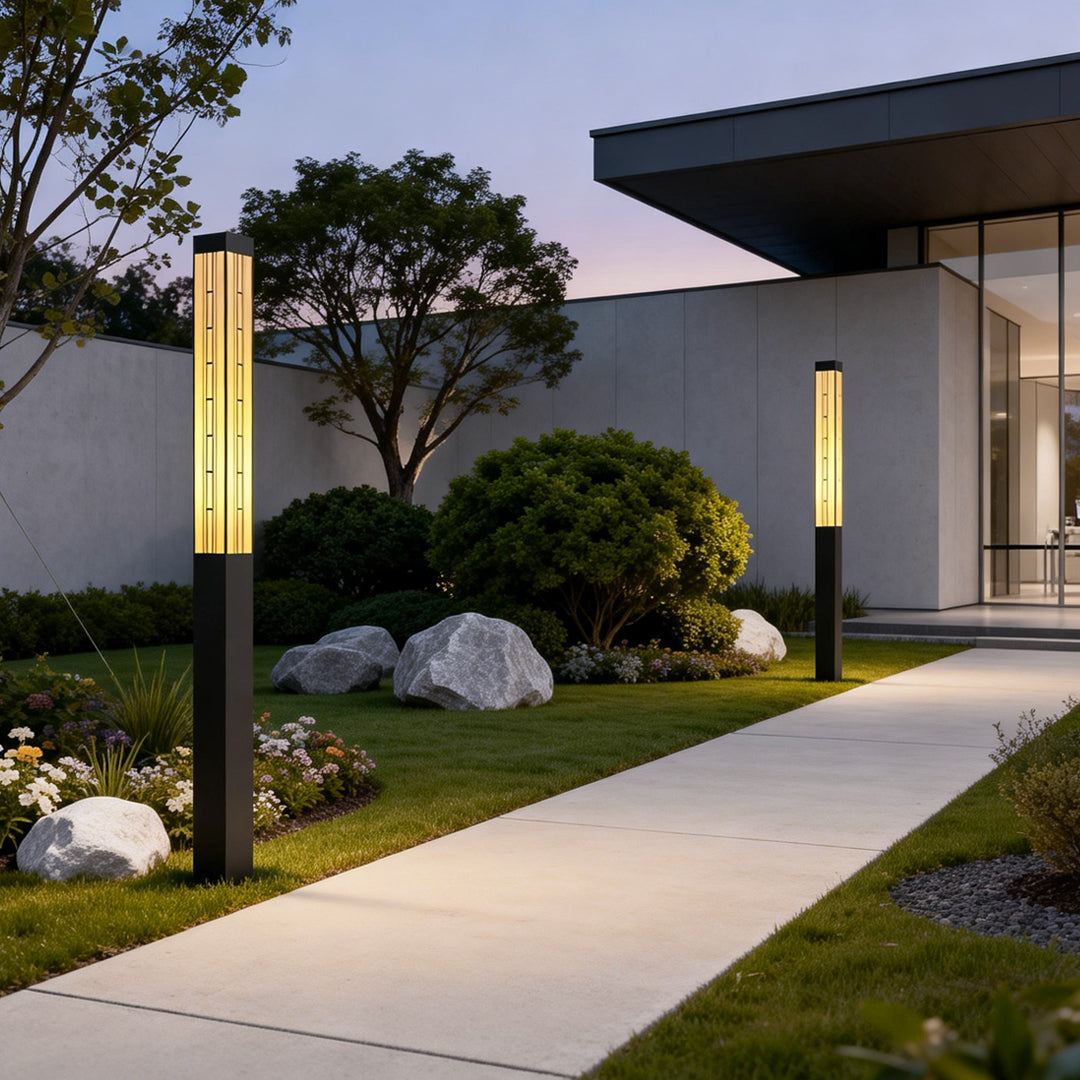 LED marble bollard light illuminating a modern garden pathway with a sleek design.