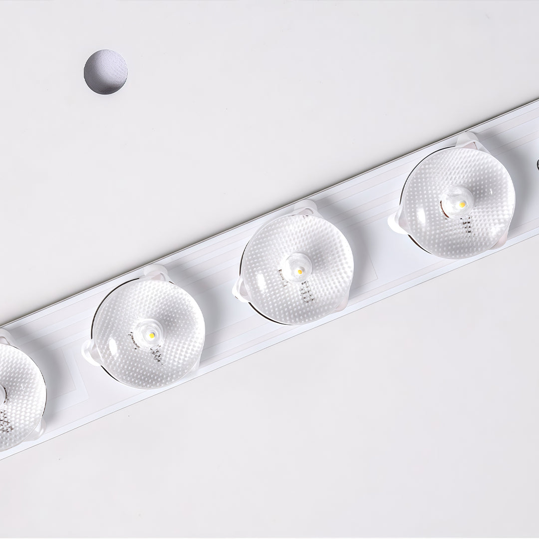 LED modern chandelier installed on a curved ceiling with sleek track and directional spotlights.