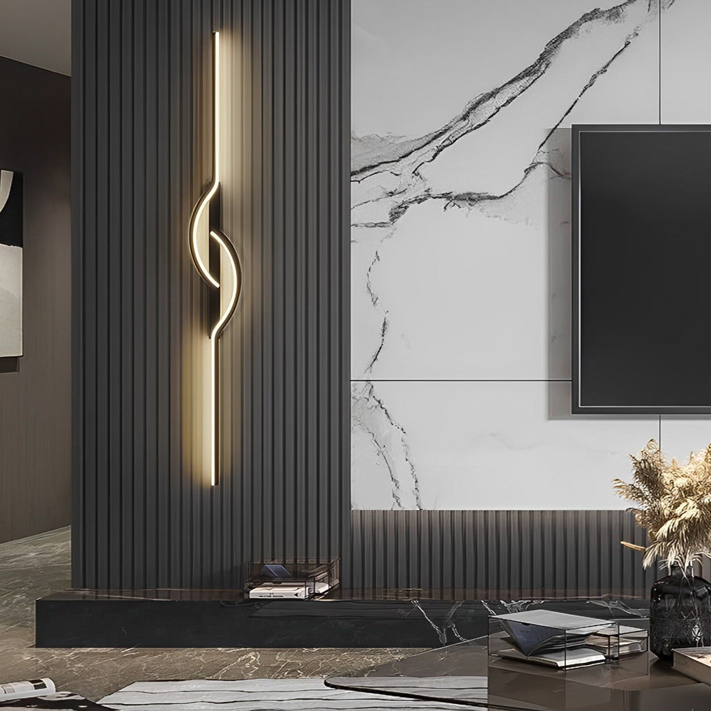 Artistic LED modern linear wall sconce installed on a dark paneled feature wall.