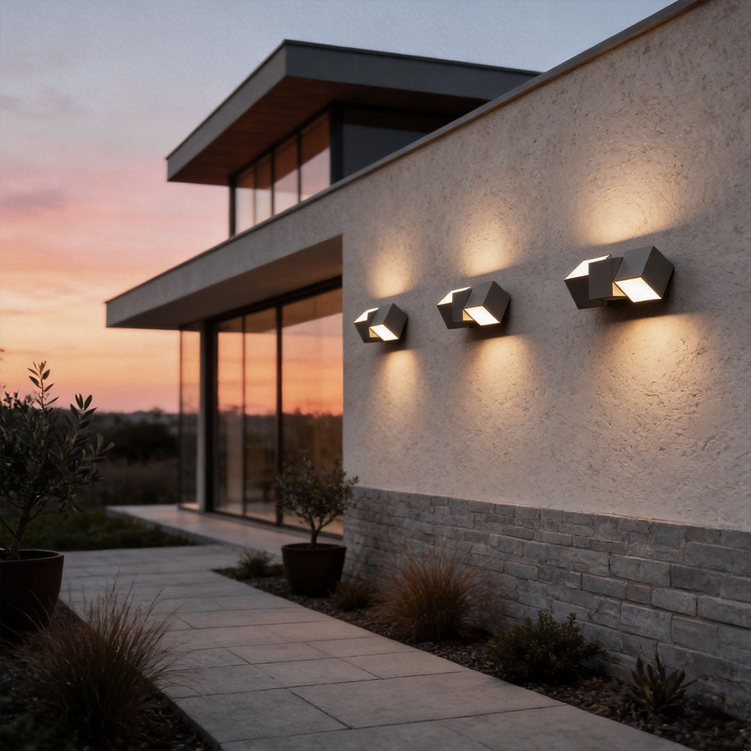 LED outdoor lighting wall mount with a sleek geometric design, enhancing a modern house facade.