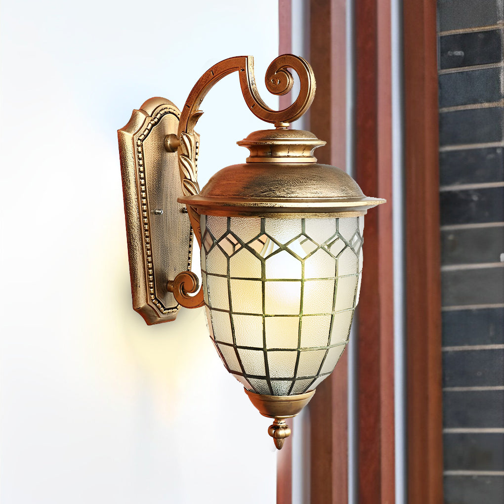 Bronze finish LED outdoor sconce mounted on white exterior wall.