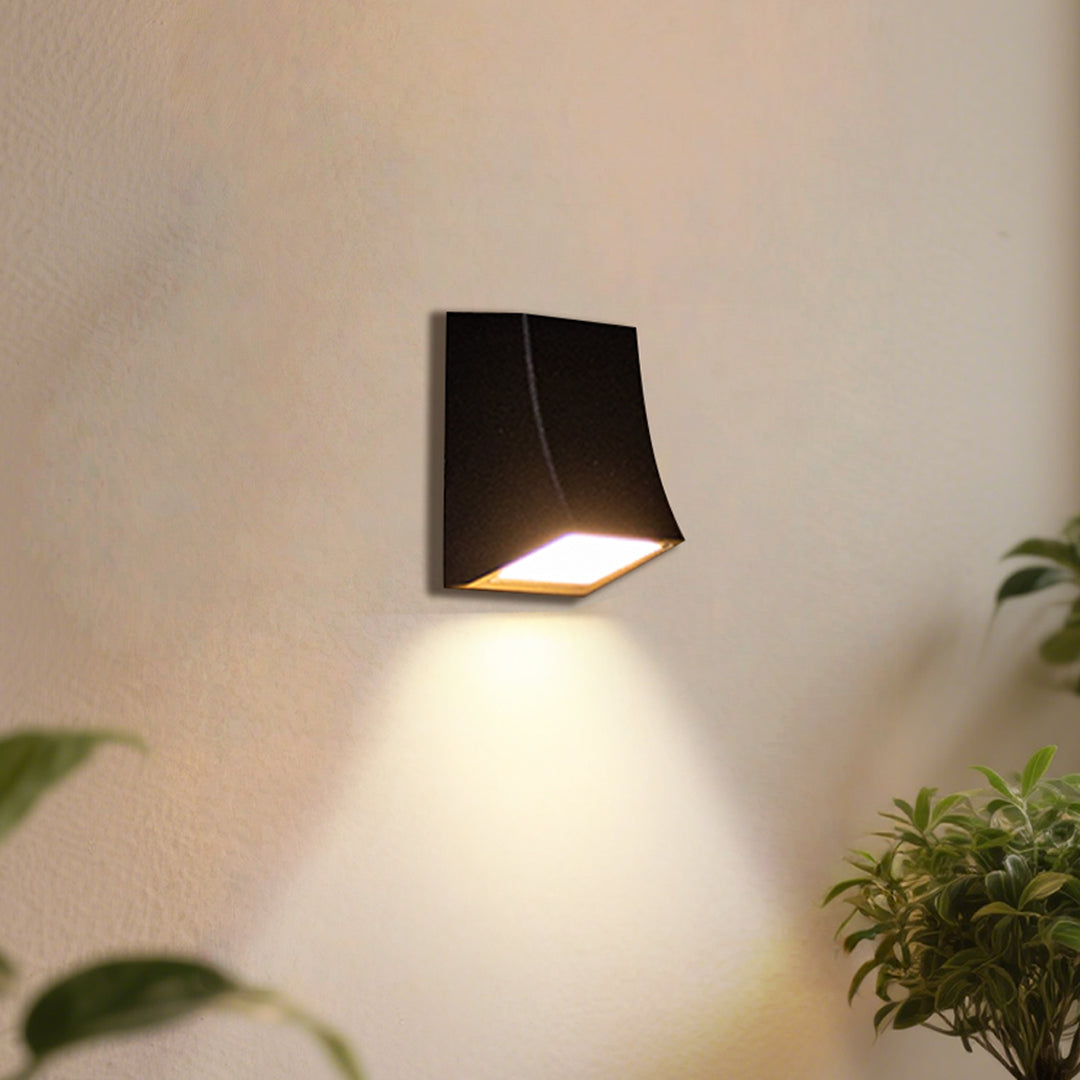 LED outdoor wall sconce with upward and downward lighting, adding depth to outdoor spaces.