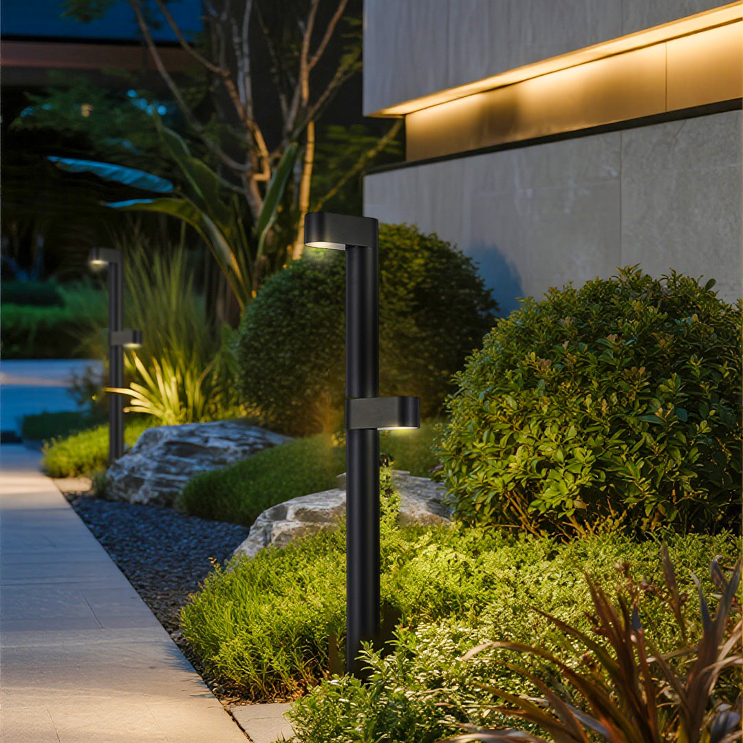 LED path light illuminating lush garden landscaping at dusk creating ambient outdoor atmosphere