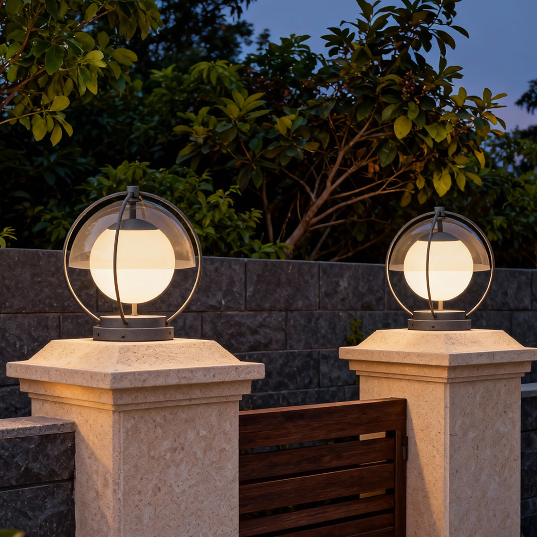 Pair of led pillar lights outdoor installed on entrance pillars with globe design providing ambient lighting for driveway