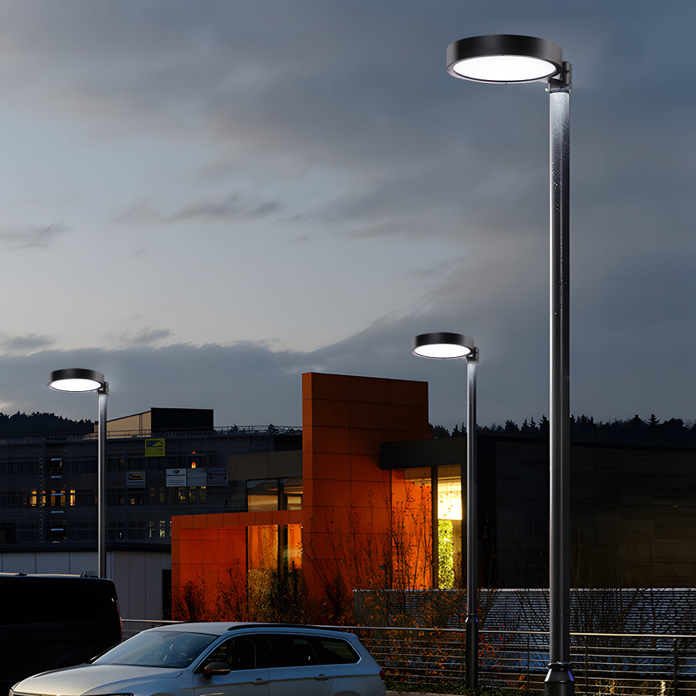 LED pole light with a minimalist design, providing soft illumination in a residential area.
