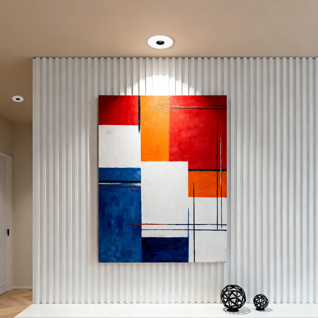 LED recessed spotlight illuminating modern gallery wall with colorful abstract artwork and ribbed paneling