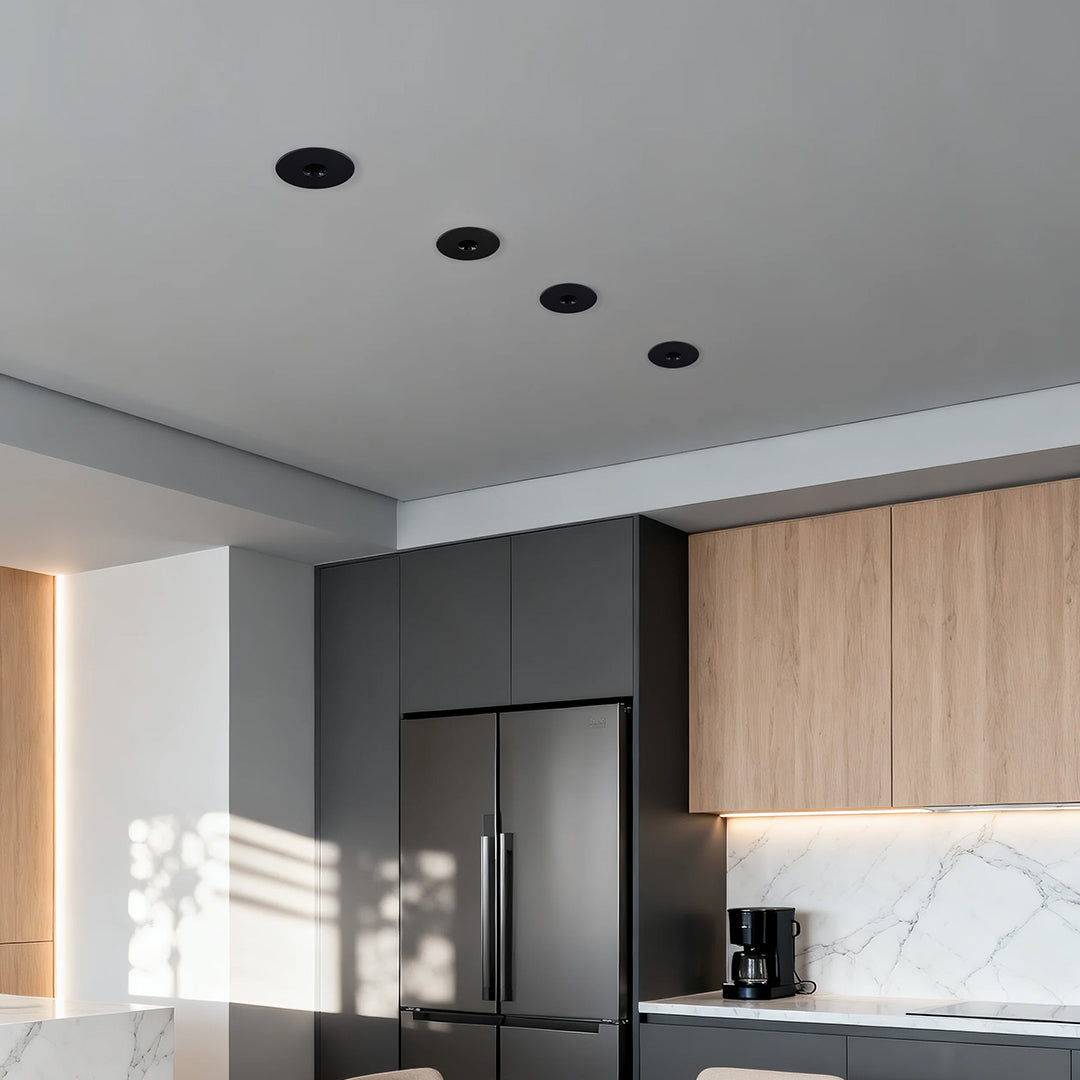 LED recessed spotlights enhancing contemporary kitchen with wood cabinetry and natural light