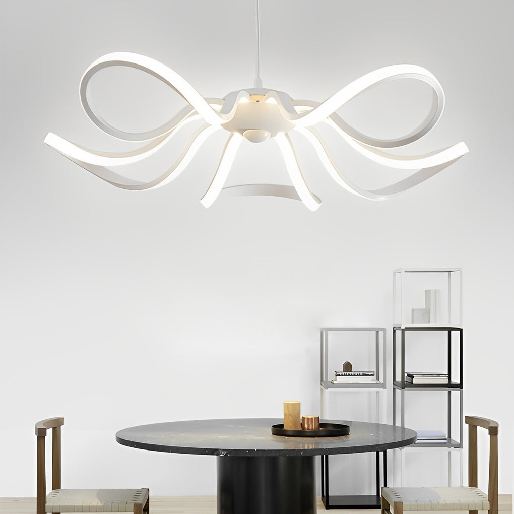 LED ribbon chandelier hanging above a dining table, complementing a room with wooden accents.