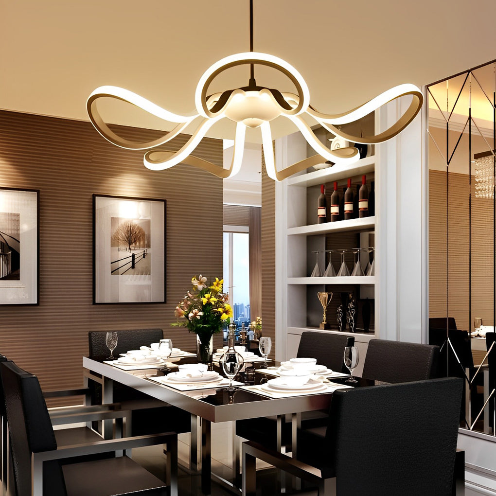 LED ribbon chandelier in a modern living space, casting a soft glow over a stylish dining setup.