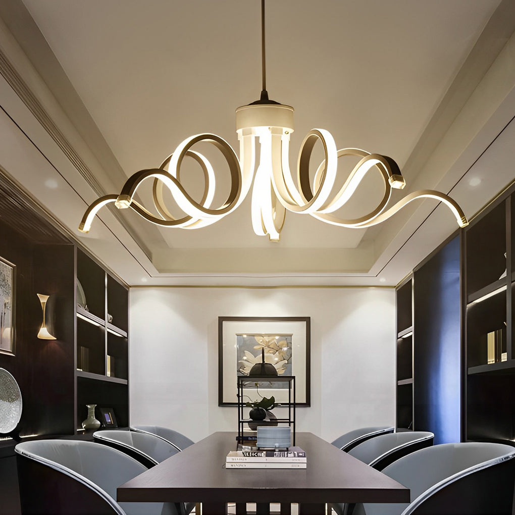 LED ribbon chandelier with a sleek design, casting soft light over a modern dining area.