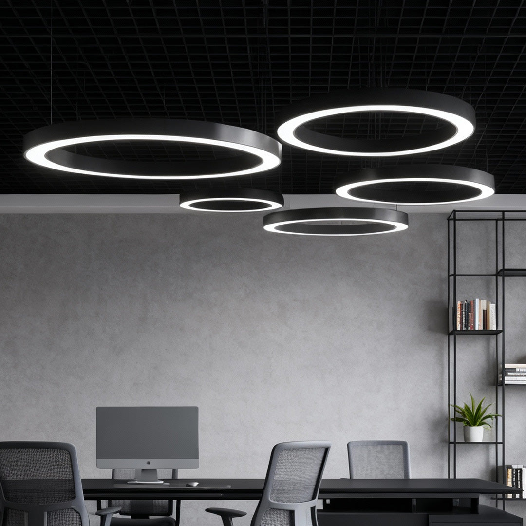 Modern LED ring pendant lights installed in an office ceiling