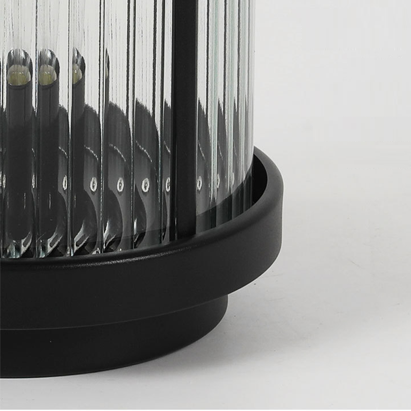 Top view of an LED solar lantern, highlighting its black top and clear glass design.