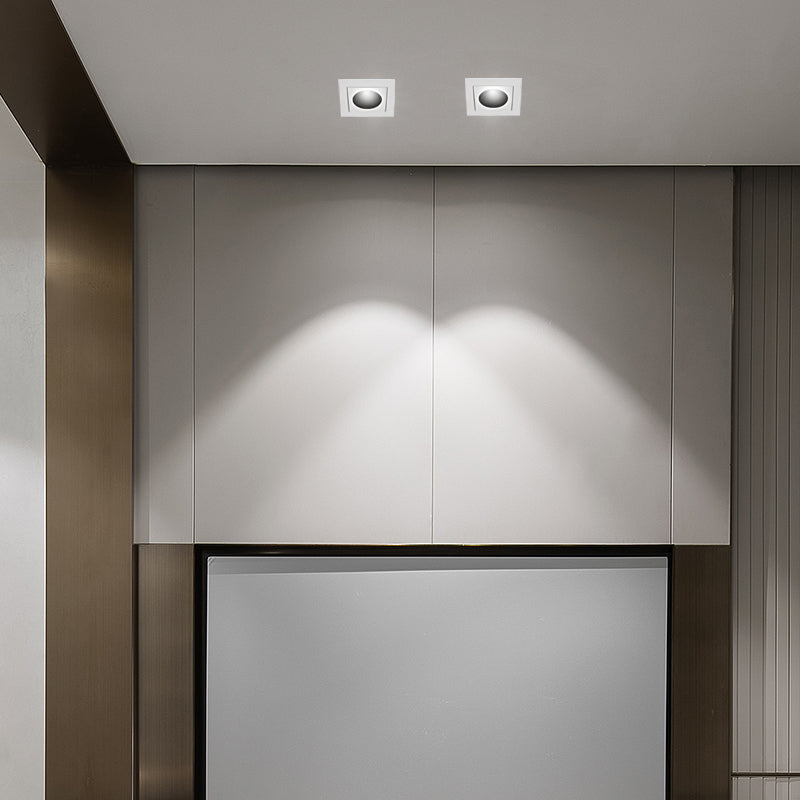 LED spotlights bulbs installed in a modern living room ceiling, providing focused illumination.