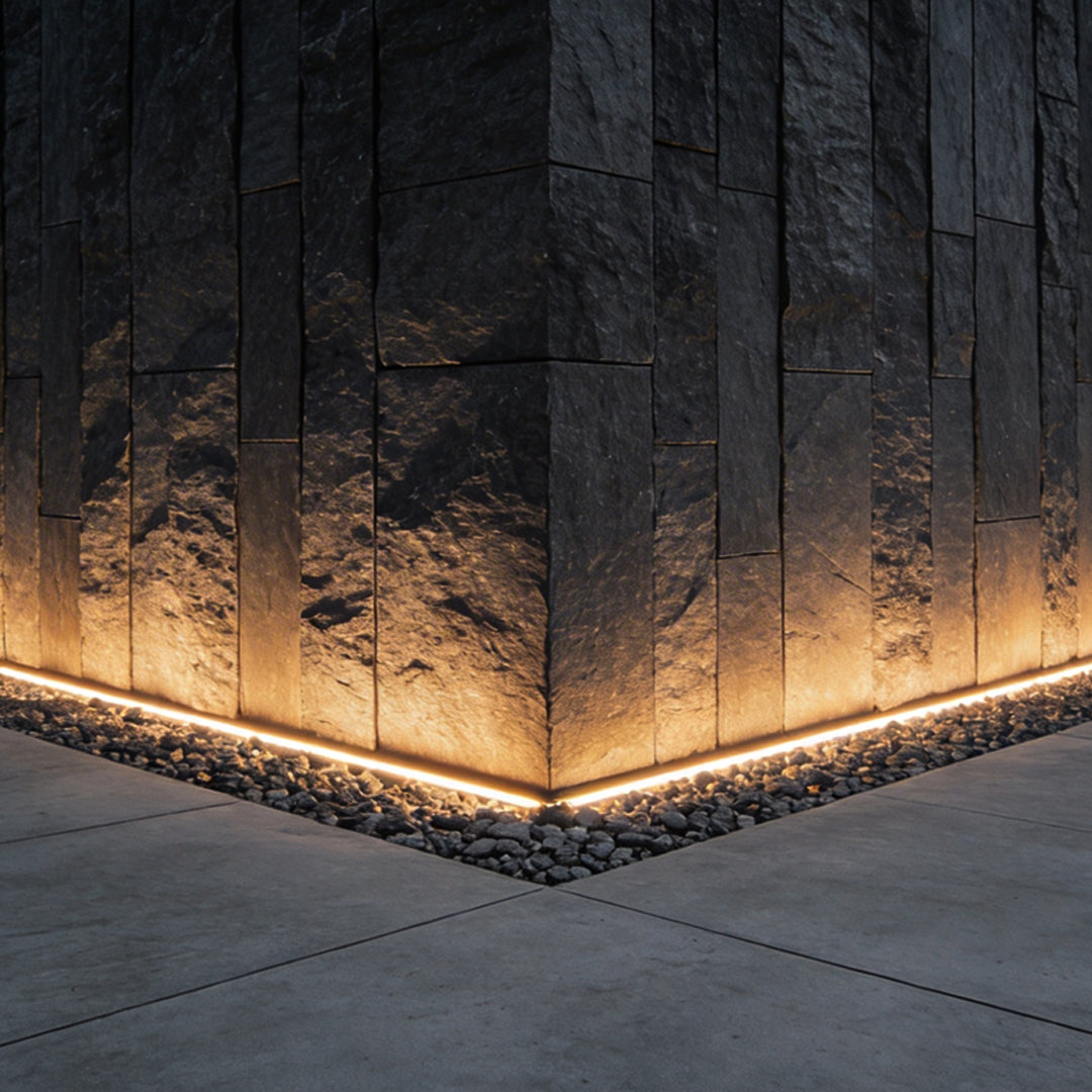 LED strip lights on wall providing ambient illumination along a stone pathway.