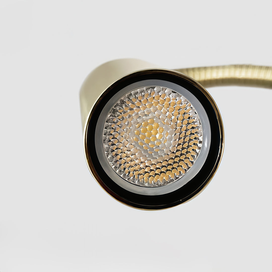Close-up detail of LED swing arm wall mount light with flexible reading head.