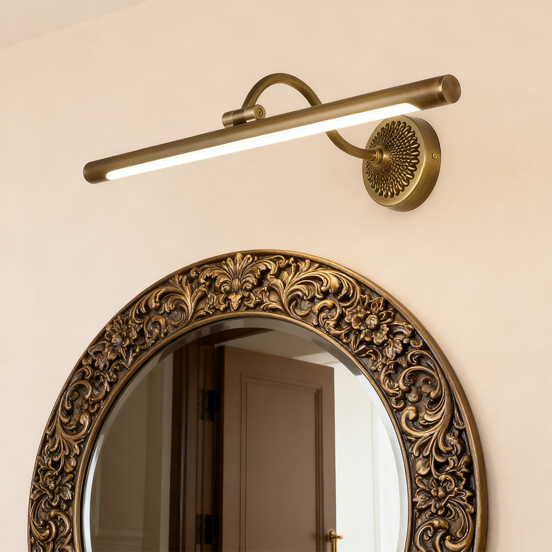 LED vanity bathroom lights in brass finish, installed above a bathroom mirror for focused lighting