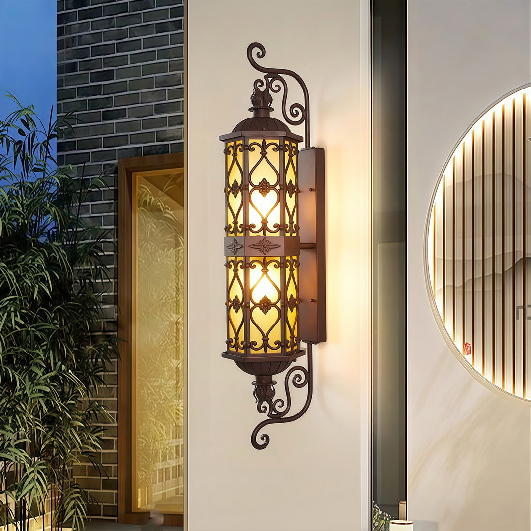 LED wall light with ornate design on the front porch of a modern home, creating a welcoming ambiance.