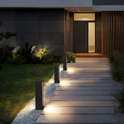 Residential exterior with multiple led wall light outdoor posts highlighting the night pathway.