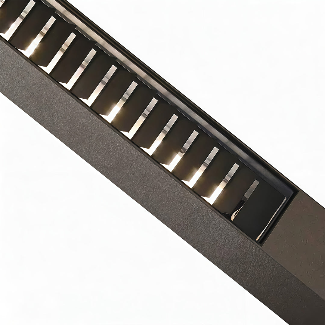LED wall sconce outdoor bollard lighting detail, angled view of modern fixture with linear LED light slots.