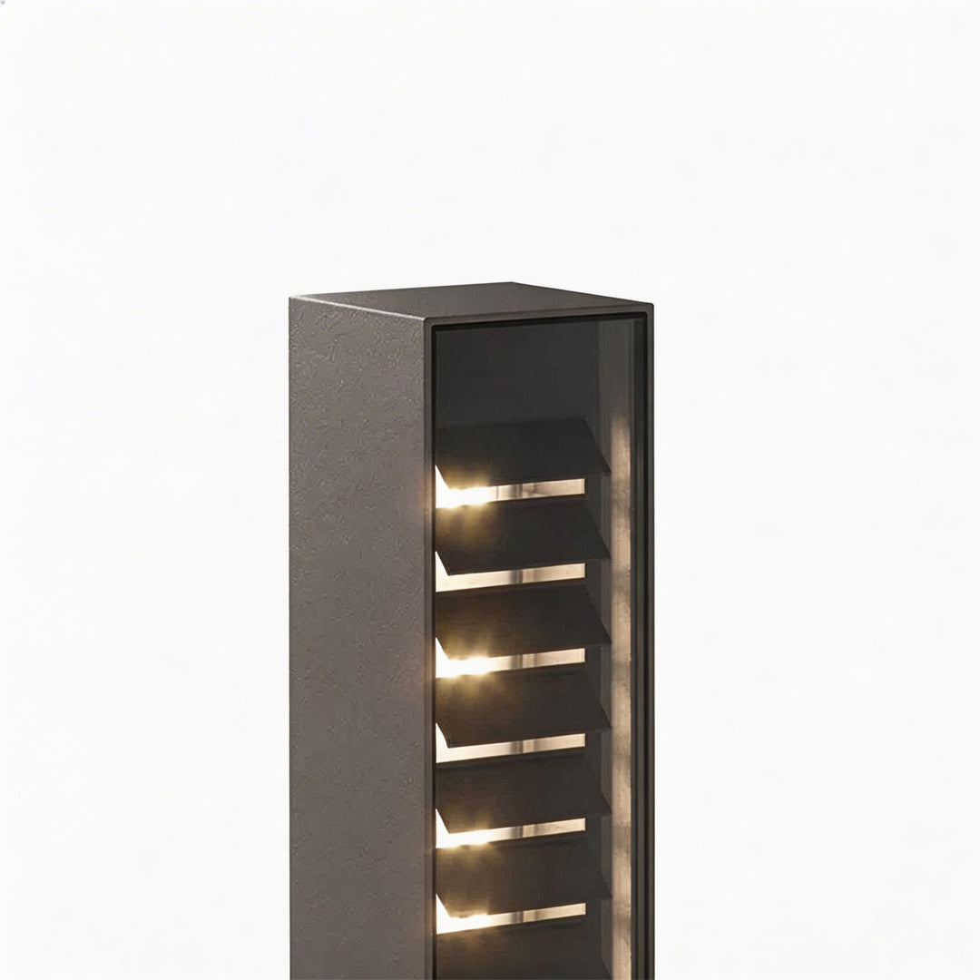 LED wall sconce outdoor bollard light close-up showing layered louver design with warm LED illumination.