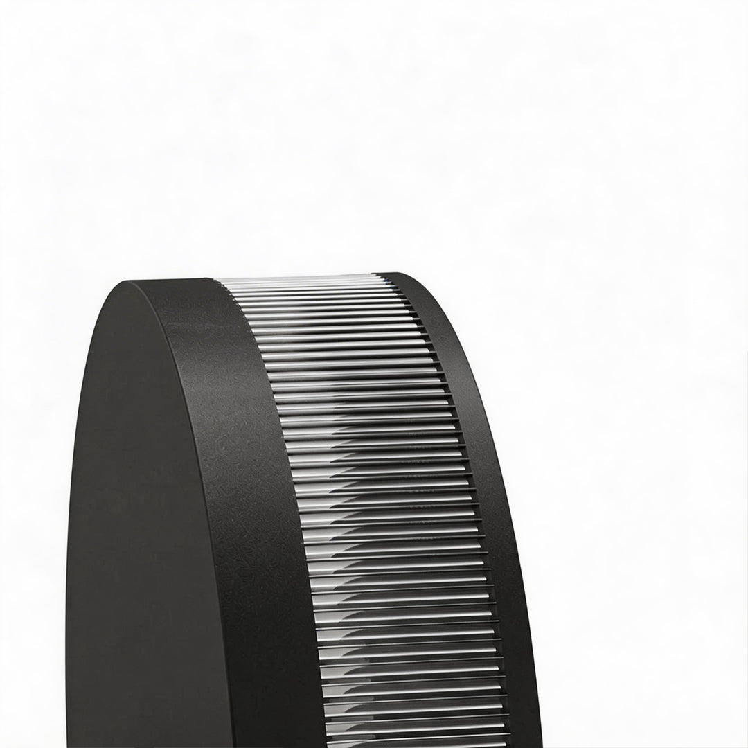 LED wall sconce outdoor close-up showing black round frame with ribbed diffuser detail and warm lighting effect.