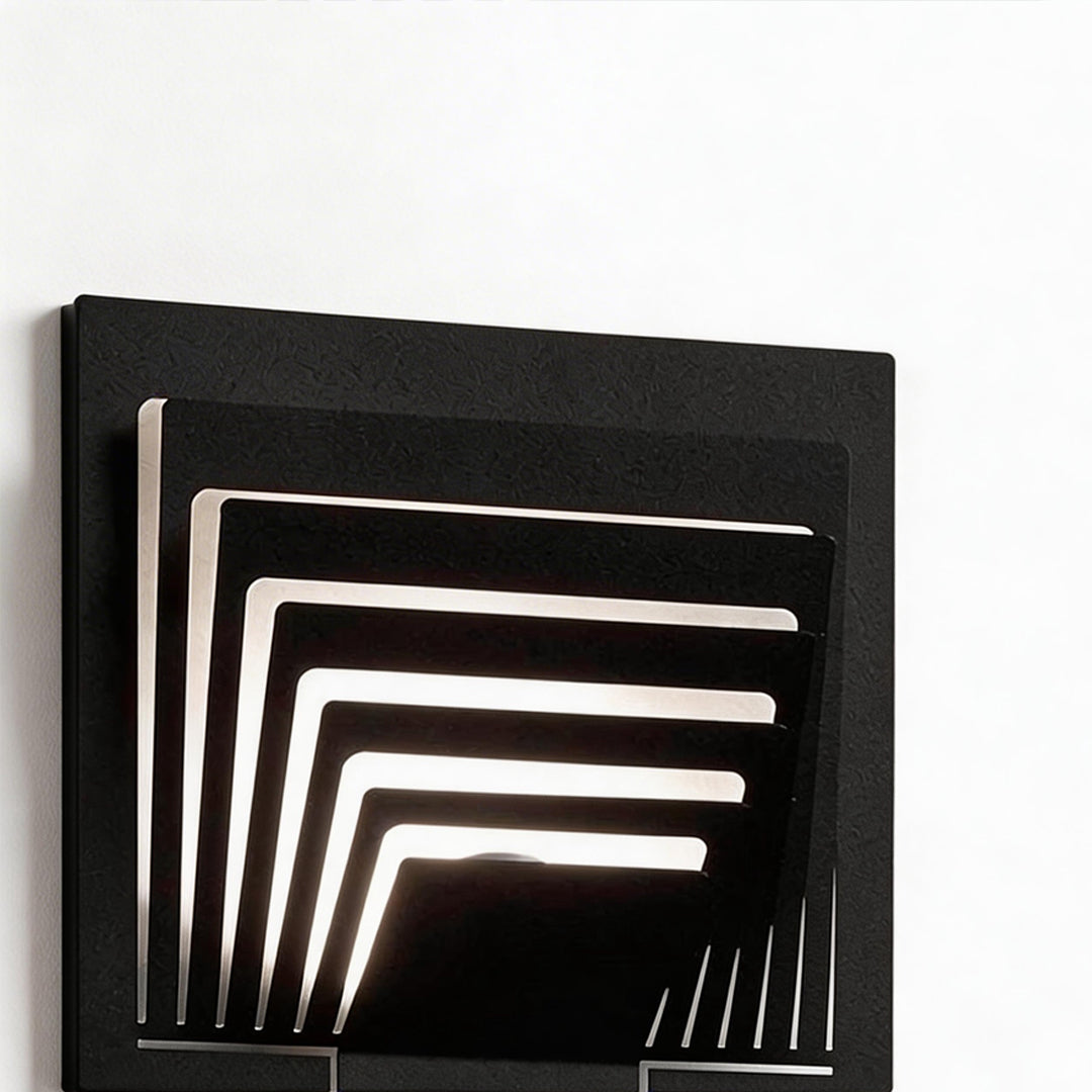 LED wall sconce outdoor close-up of square wall mount outdoor light showing layered frame and warm LED strips.