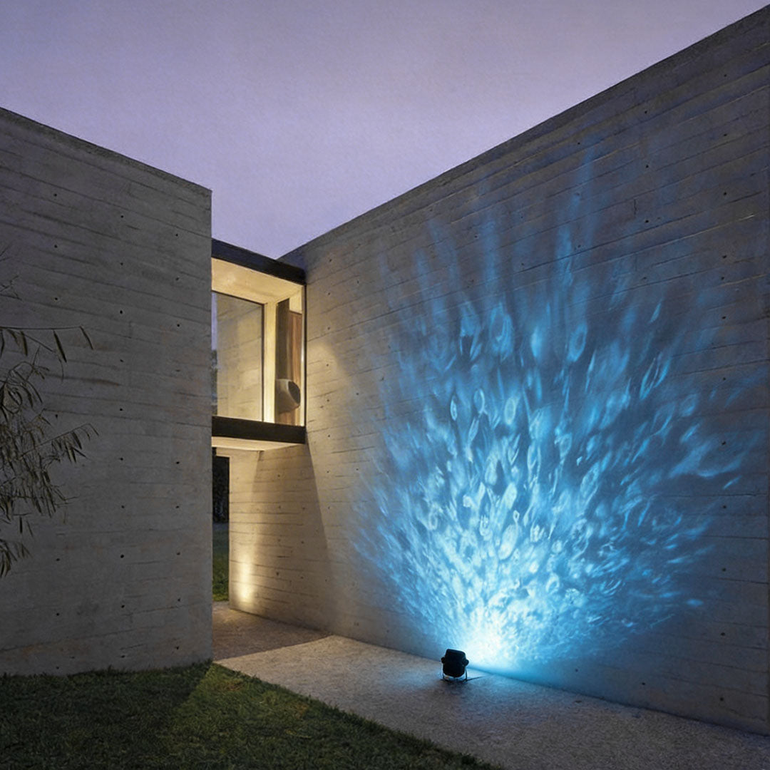 LED wall sconce outdoor exterior spotlights creating dynamic blue lighting effect on concrete wall.