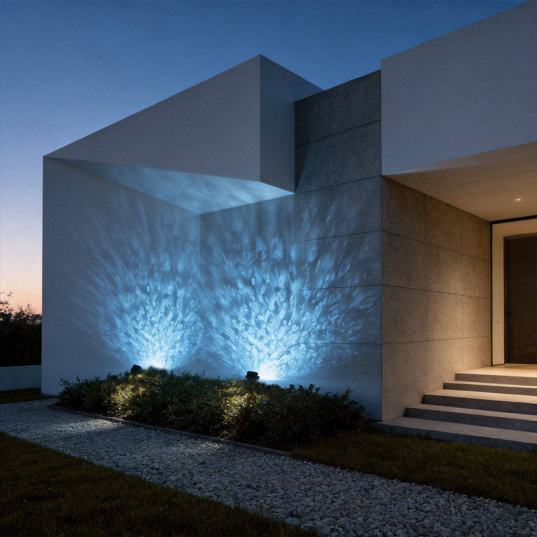 LED wall sconce outdoor exterior spotlights casting blue light patterns on modern building facade at night.