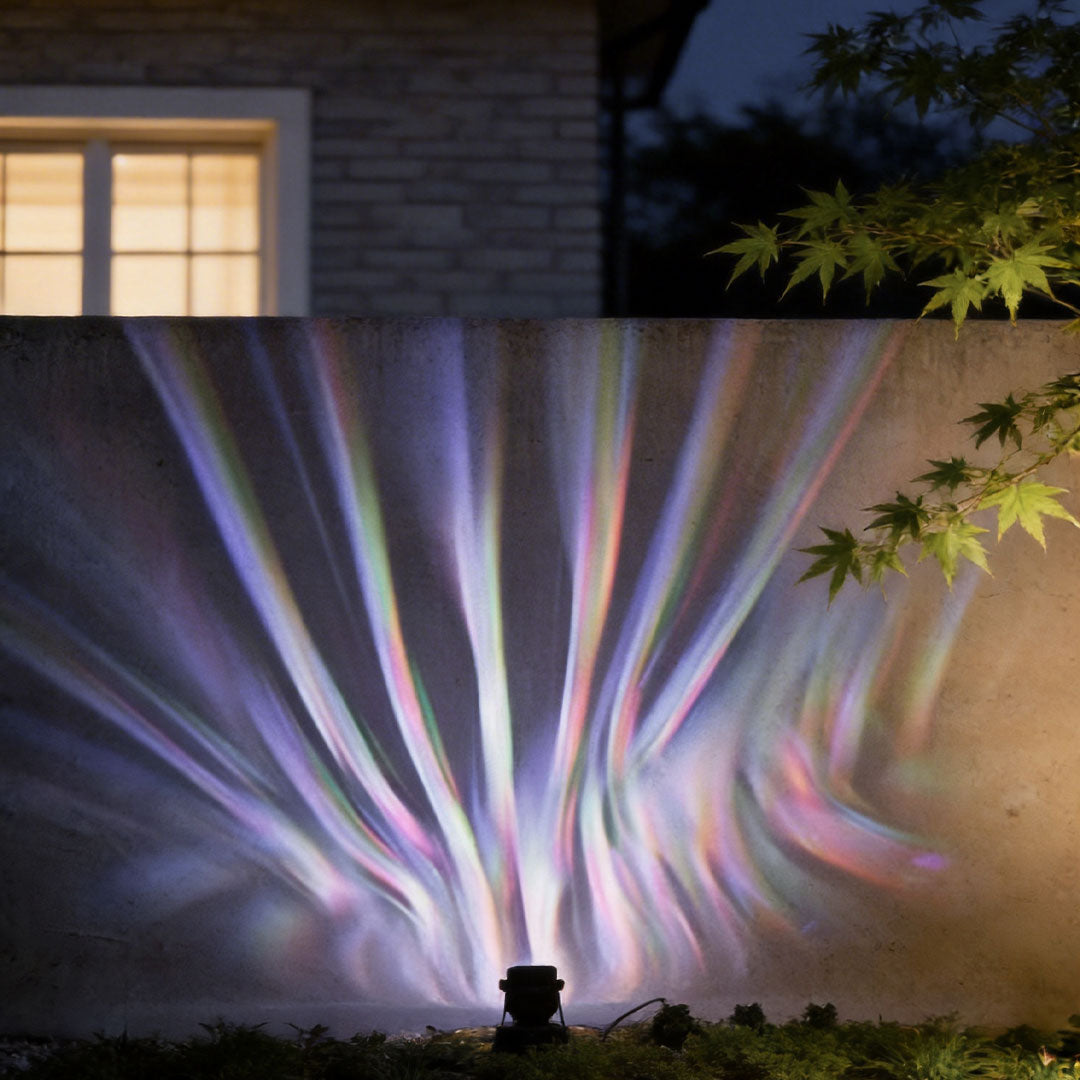 LED wall sconce outdoor exterior spotlights with colorful lighting effects illuminating garden wall at night.