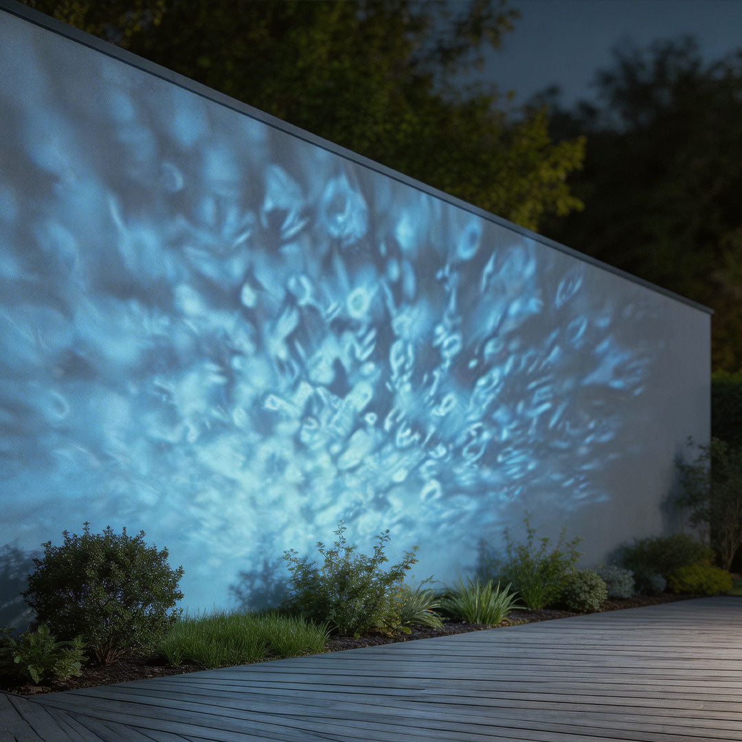 LED wall sconce outdoor exterior spotlights projecting textured blue light across large outdoor wall.