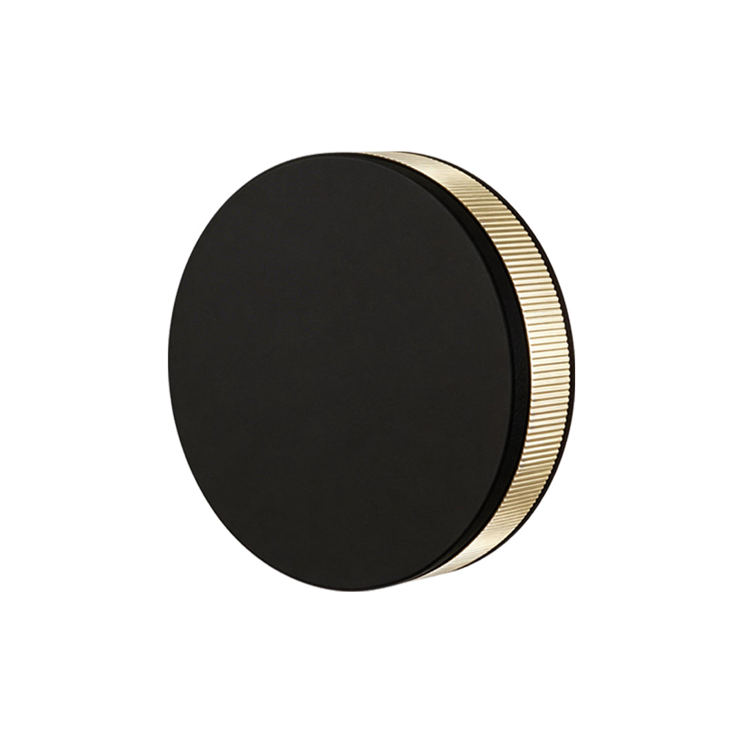 LED wall sconce outdoor large round fixture, sleek black finish with soft backlit halo illumination.