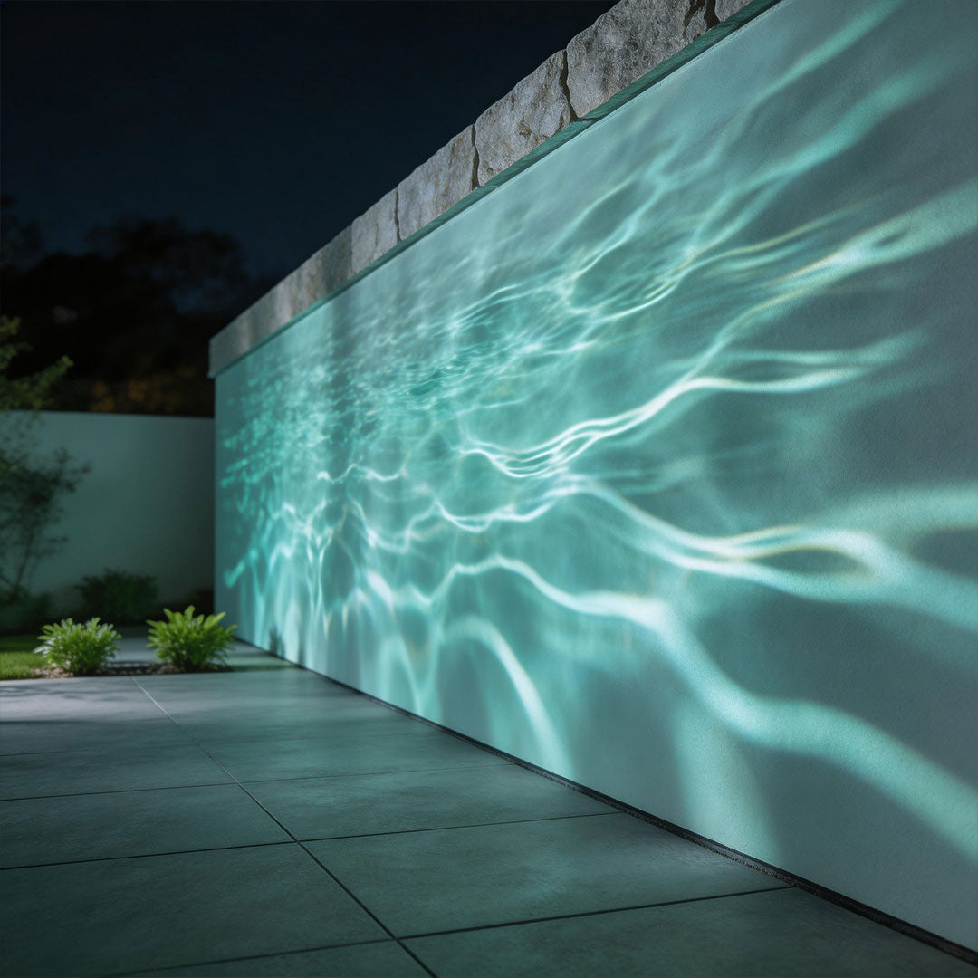 LED wall sconce outdoor outdoor spotlight LED producing aqua wave light effect across exterior wall surface.