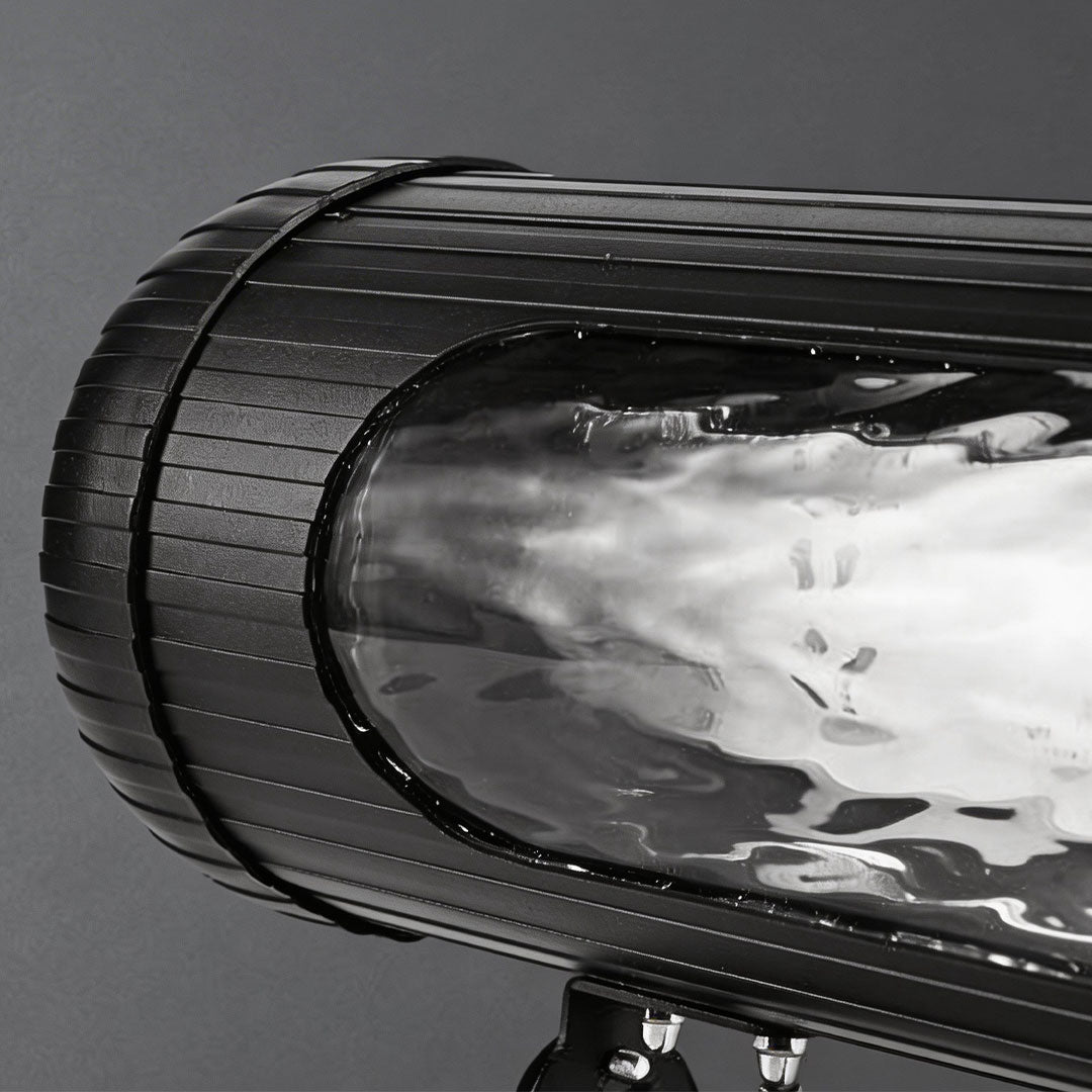 LED wall sconce outdoor outdoor spotlight LED close-up showing cylindrical housing and textured lens detail.