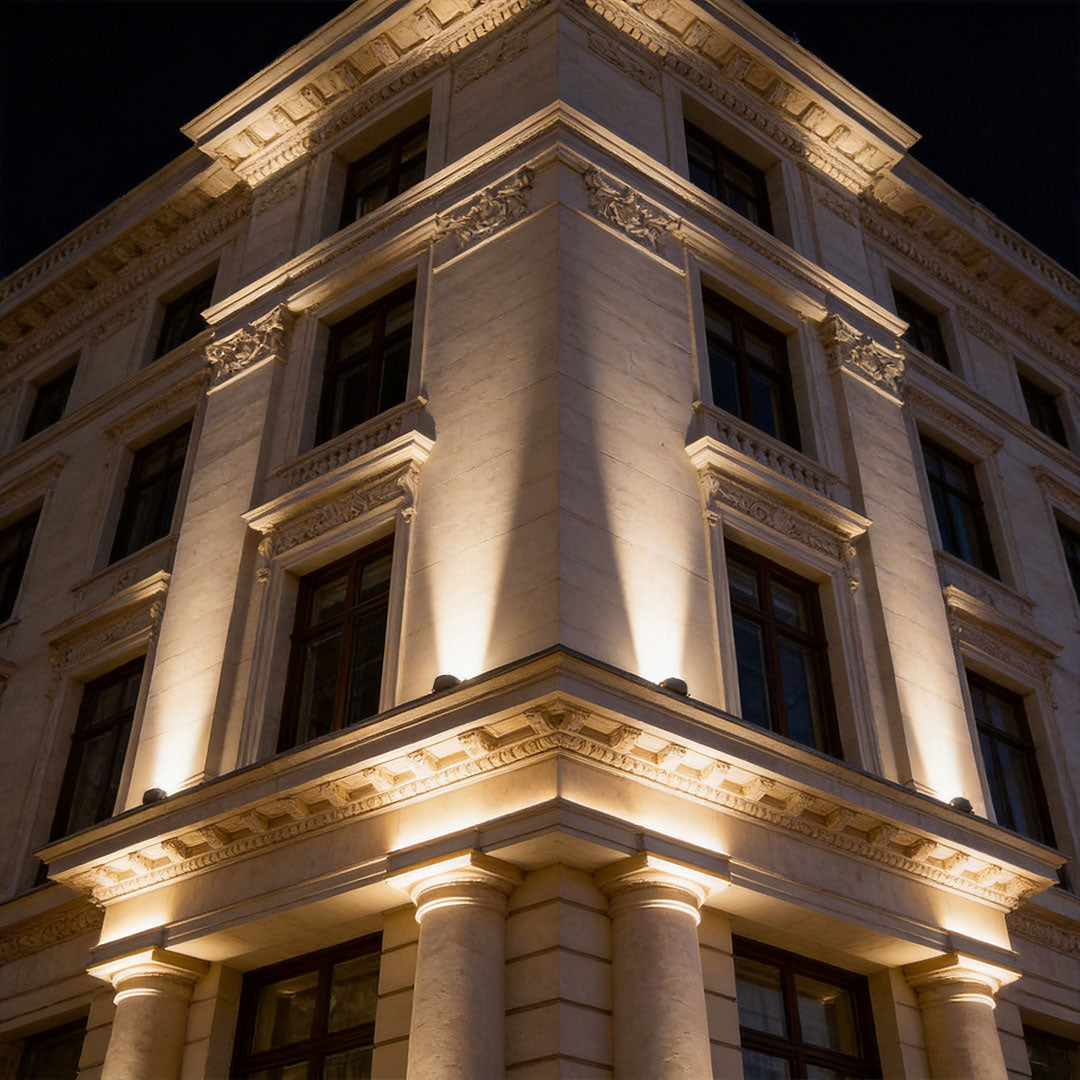 LED wall sconce outdoor outdoor spotlights LED illuminating building facade with dramatic architectural lighting.