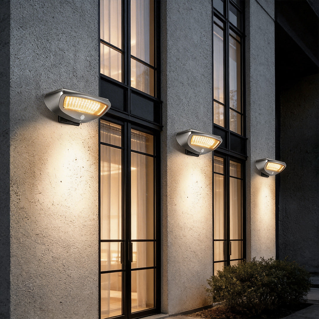 LED wall sconce outdoor outdoor wall mounted solar lights installed along exterior wall for pathway lighting.