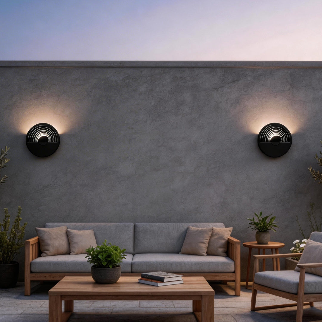 LED wall sconce outdoor round wall mount outdoor light on patio wall, warm glow enhancing outdoor seating space.