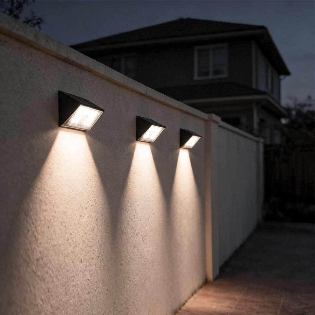 LED wall sconce outdoor sensor wall lights outdoor on textured wall, soft up and down lighting effect at night.