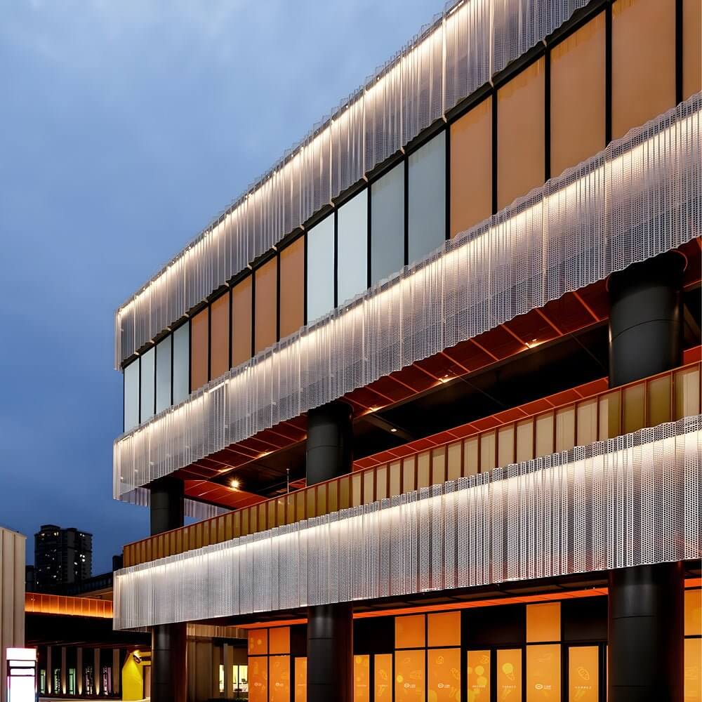 LED wall washer light installed on a modern commercial building, providing vibrant and even illumination.