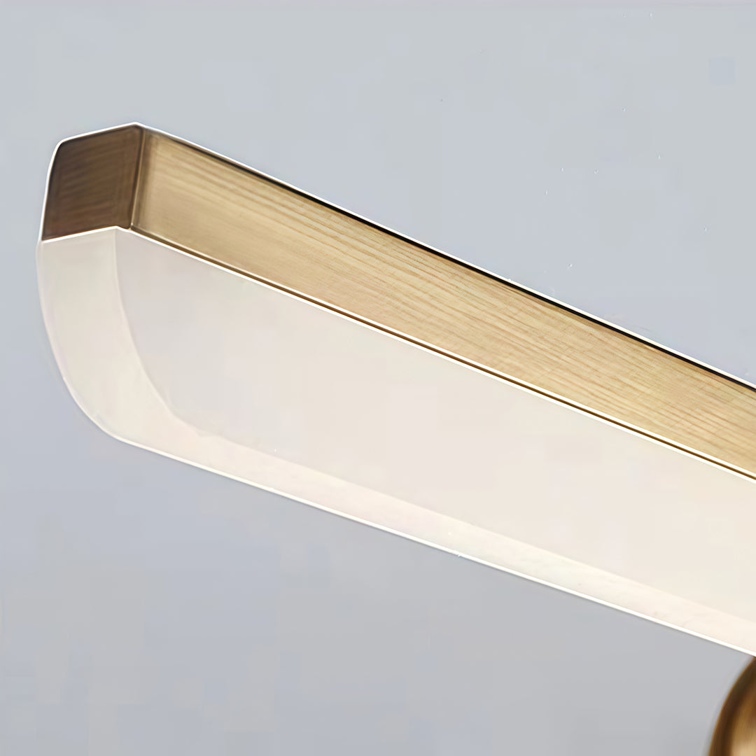 Light bar vanity with a close-up of its gold finish and light diffusion.