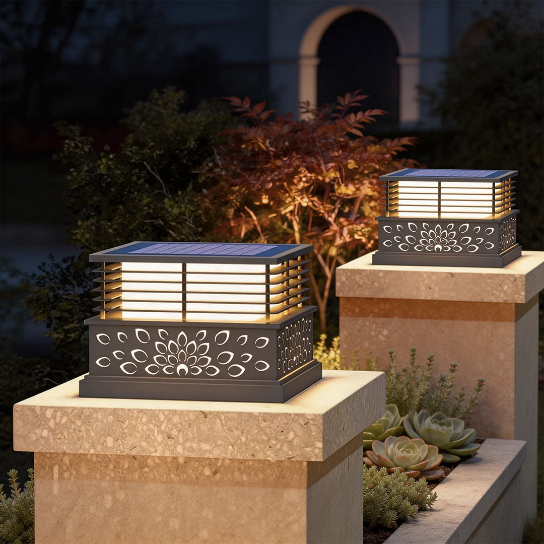 Stylish light pillar for home with a warm glow, installed on a stone pillar in a garden setting.