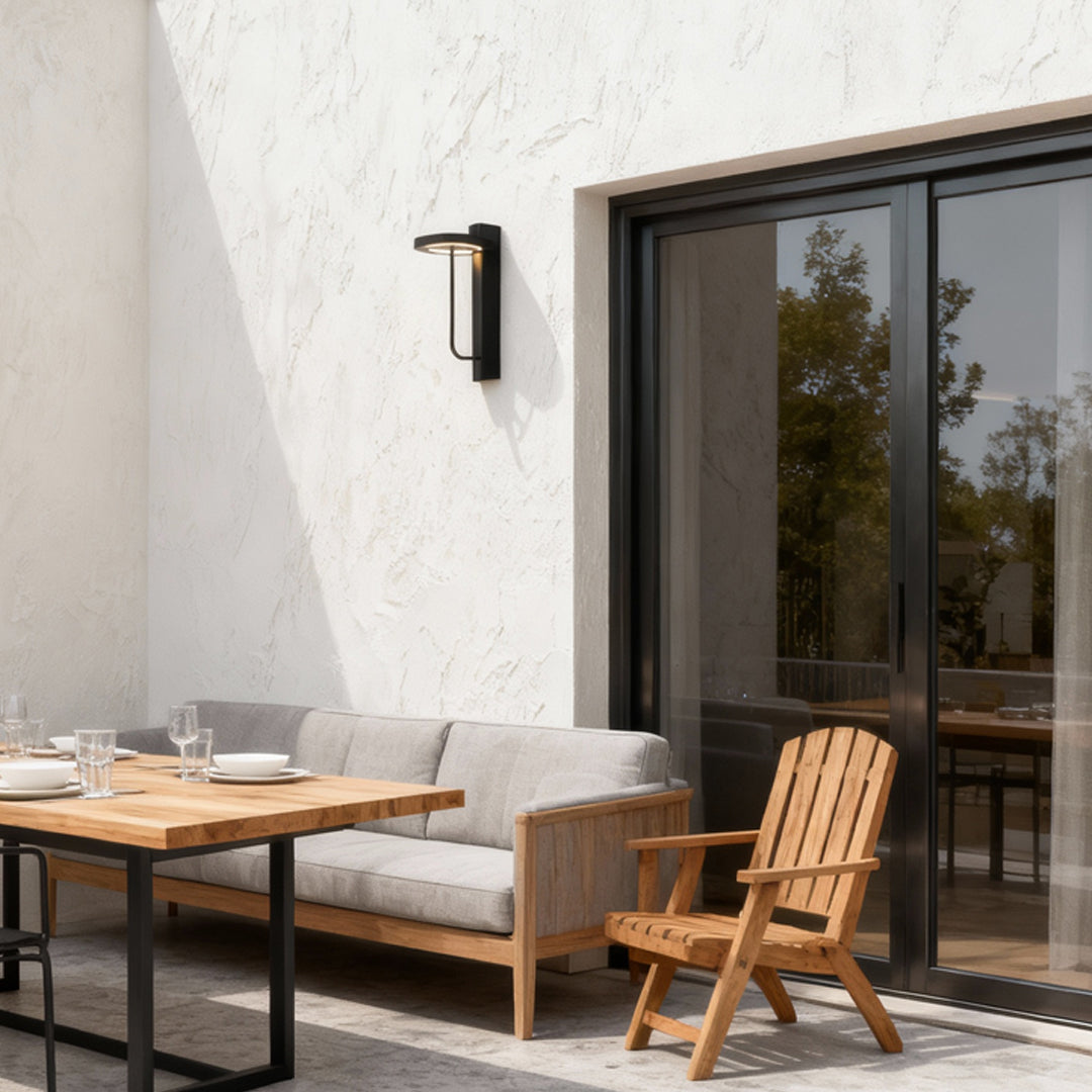 Light sconces outdoor mounted on a white exterior dining wall, providing warm accent illumination.