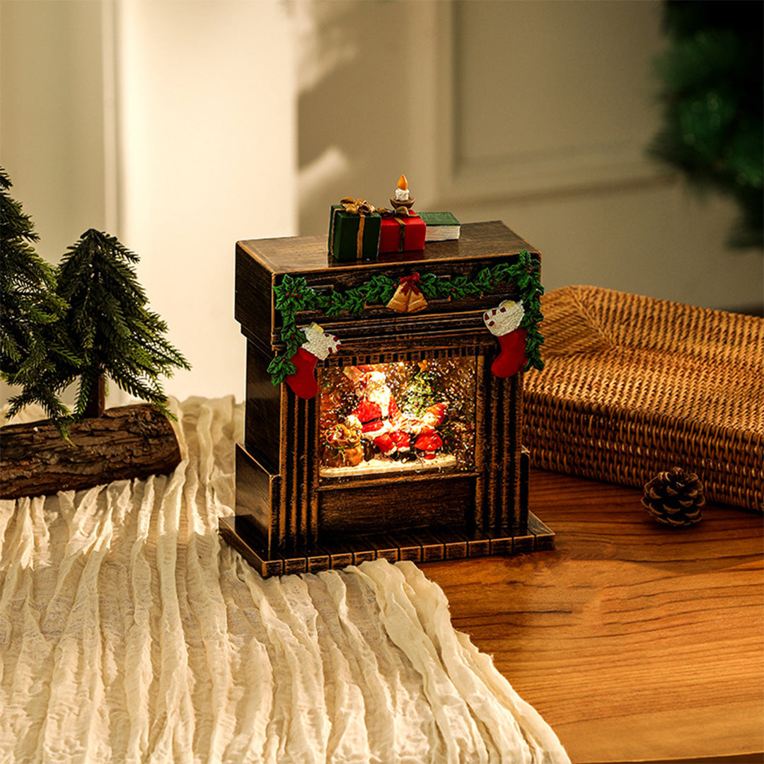 gold-tone christmas fireplace ornament with internal LED lights and festive garlands