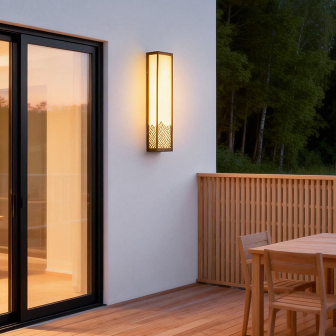 Lightbox wall lamp providing soft illumination beside a sliding glass door.
