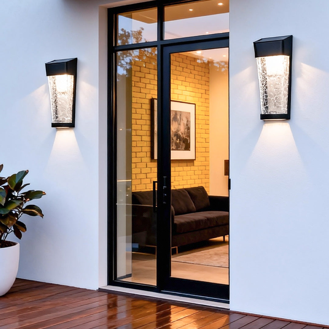 A tall outdoor entryway lantern with textured glass, delivering bright illumination and refined lighted outdoor wall decor for entrances.