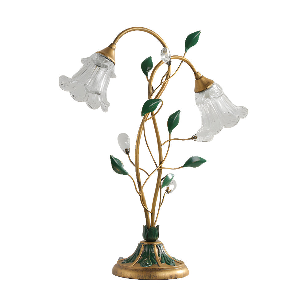 Lily table lamp in gold and green, side view of the artistic design.